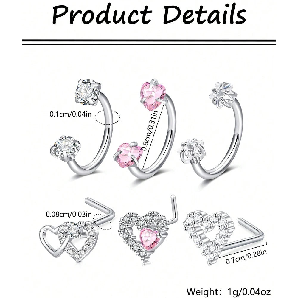 Tres pendientes en forma de corazón y herradura de acero inoxidable en tono plateado con piedras transparentes.