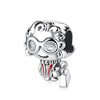 A silver family tree charm jewelry piece featuring a stylized face wearing round glasses and a red and white striped shirt.