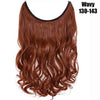 A bundle of wavy, reddish-brown hair extensions with a dark elastic band.