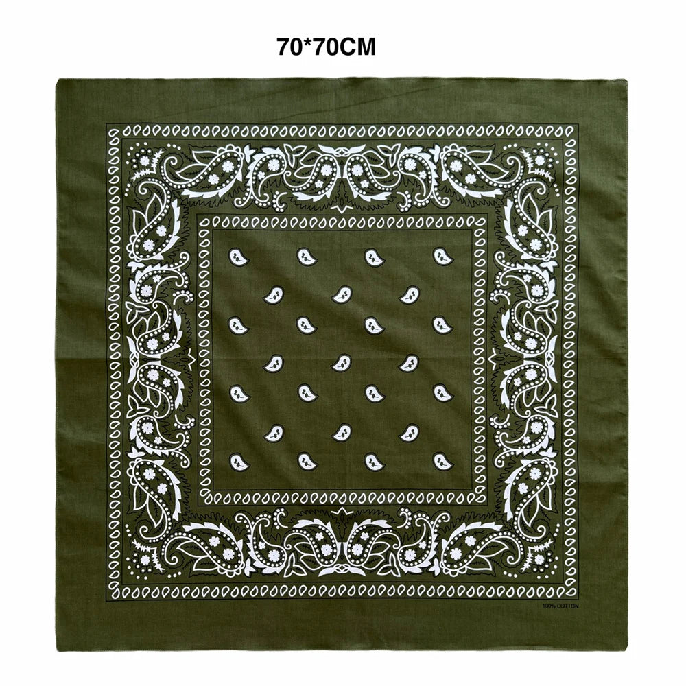 A dark olive green square scarf featuring white paisley embroidery and geometric patterns.