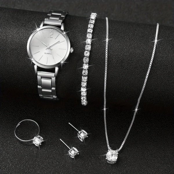 A silver quartz wristwatch and a long diamond necklace displayed on a black background.