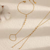 A delicate gold-plated bracelet featuring small zircon stones and a loop design.