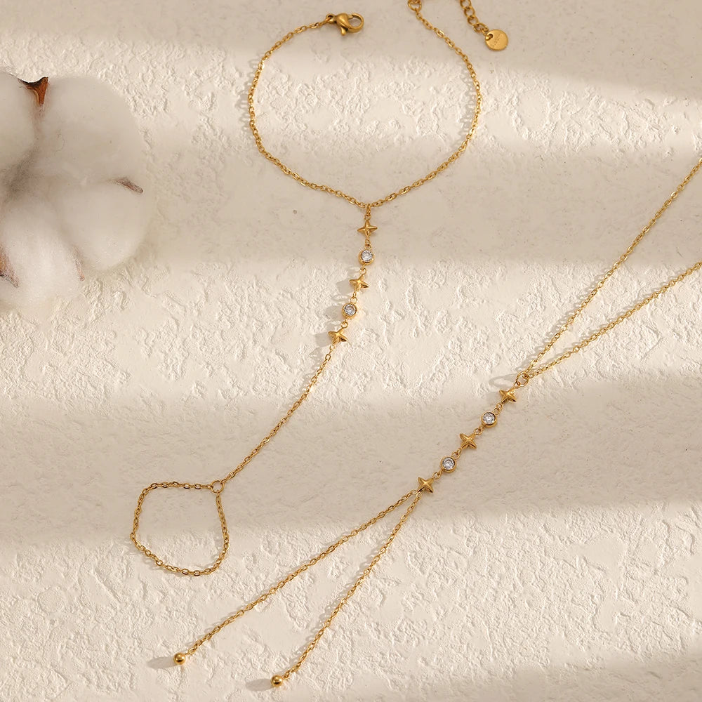 A delicate gold-plated bracelet featuring small zircon stones and a loop design.