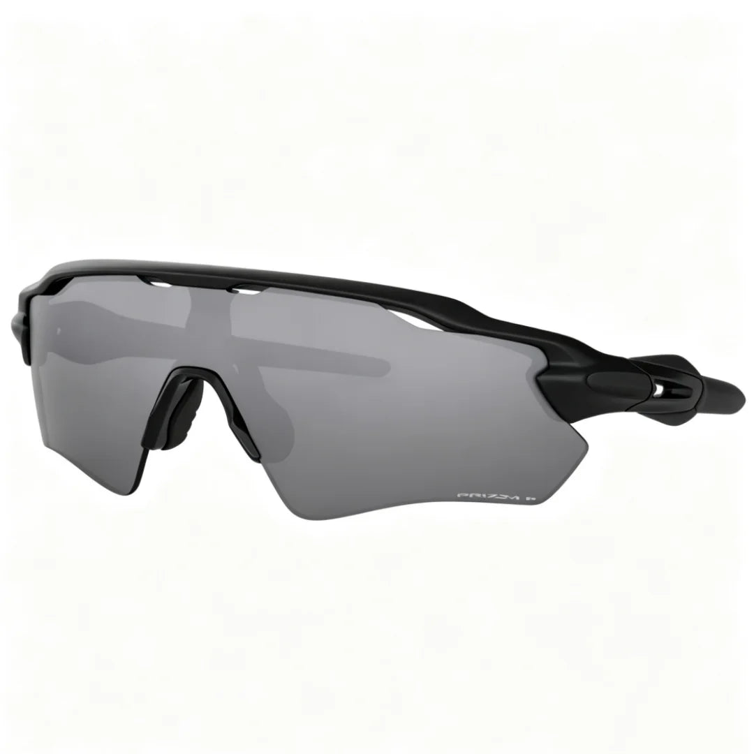 Gray cycling sunglasses with a black frame shown from the side.