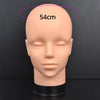 A realistic, flesh-toned mannequin head with a measurement marker indicating 54cm.