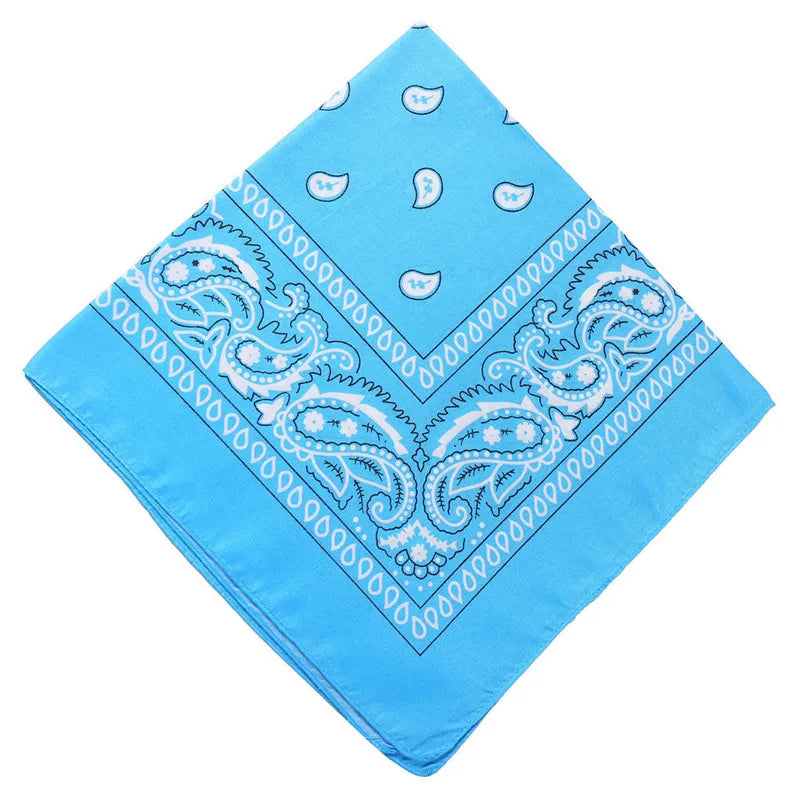 Light blue paisley bandana fabric with white patterns folded into a diamond shape