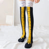 Black socks with yellow chicken print detailing and white cuff trim