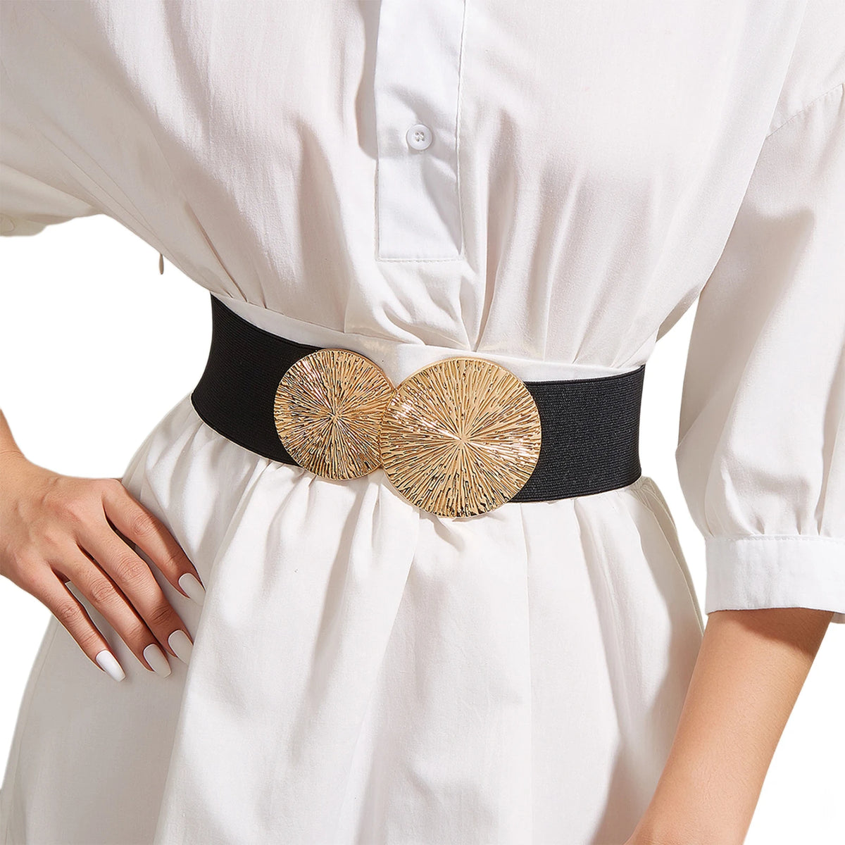 A white dress or coat features a black elastic waist belt adorned with a gold woven decorative buckle.