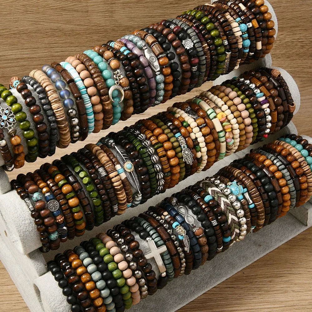 A collection of fashion elastic wood bead bracelets stacked and laid out on a light surface.