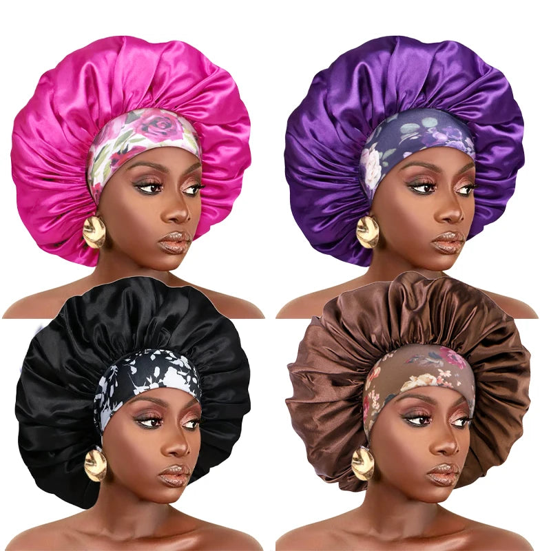 A set of three satin sleep bonnets in pink, purple, and black with elastic bands shown on a model's head.