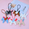 A collection of elegant horse pendant charms in various colors and styles, including brown, white, blue, and pink.