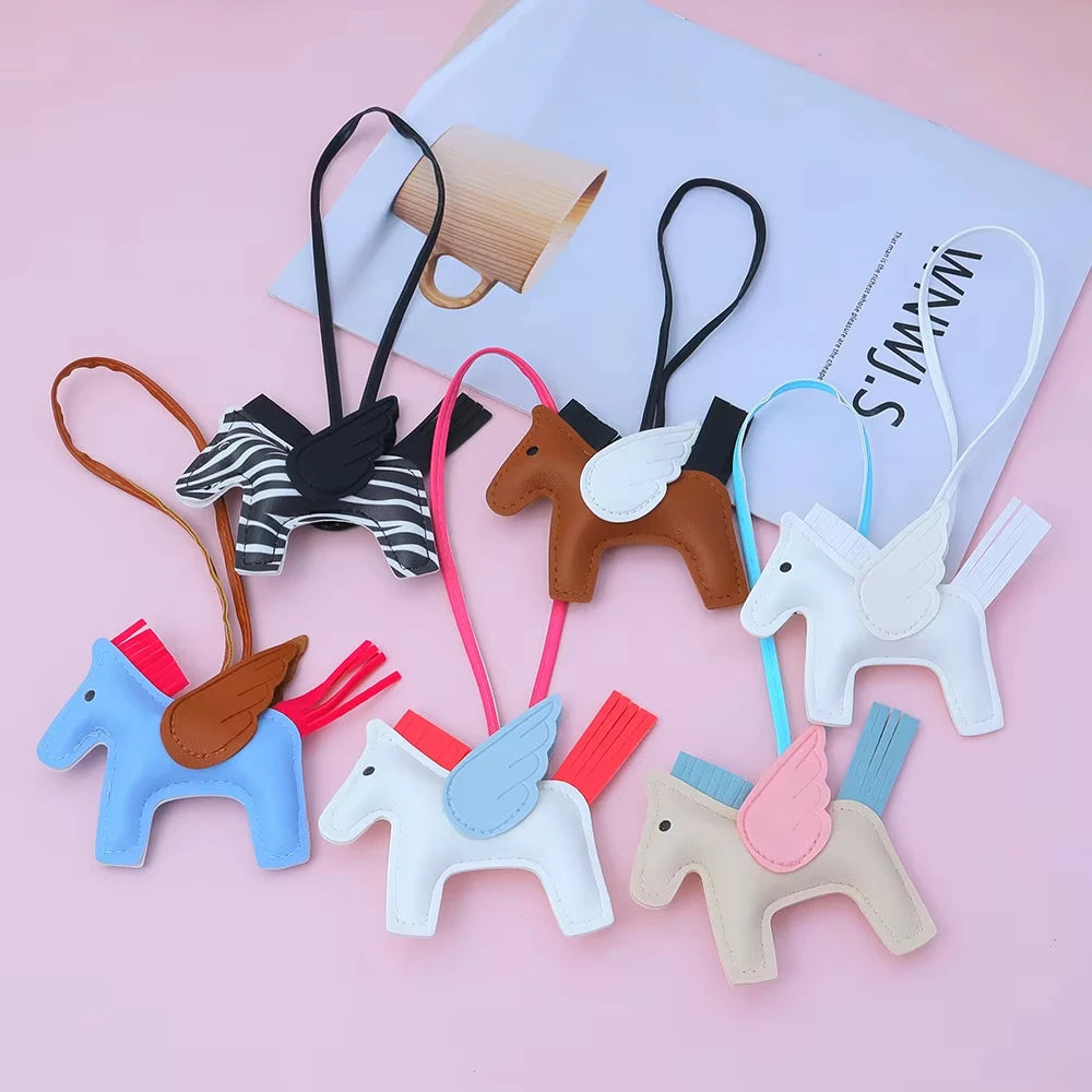 A collection of elegant horse pendant charms in various colors and styles, including brown, white, blue, and pink.