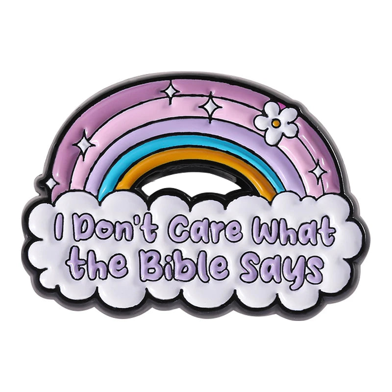 Enamel pin featuring a rainbow arch with stars and the text I Don't Care What the Bible Says