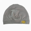 A gray Y2K skull beanie hat with a gold embroidered skull logo.