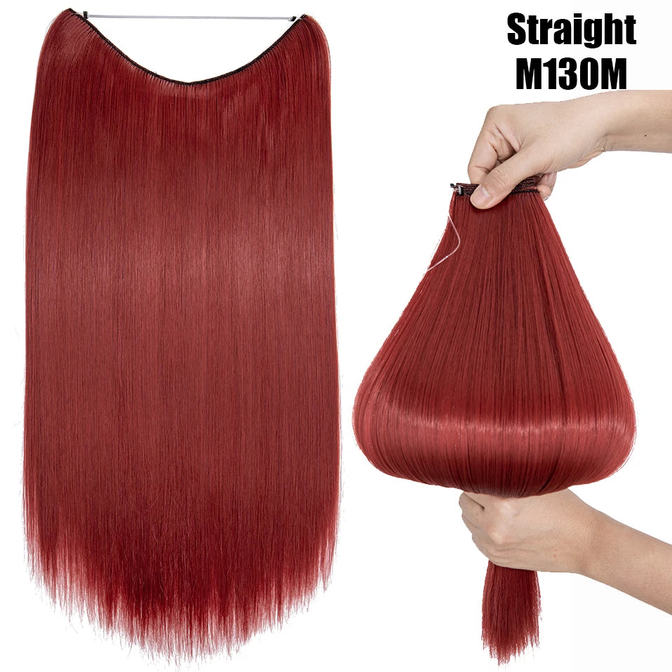 A close-up of a straight, reddish-brown hair extension being held by a hand.