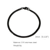 Black stainless steel Cuban link bracelet with a simple circular design.