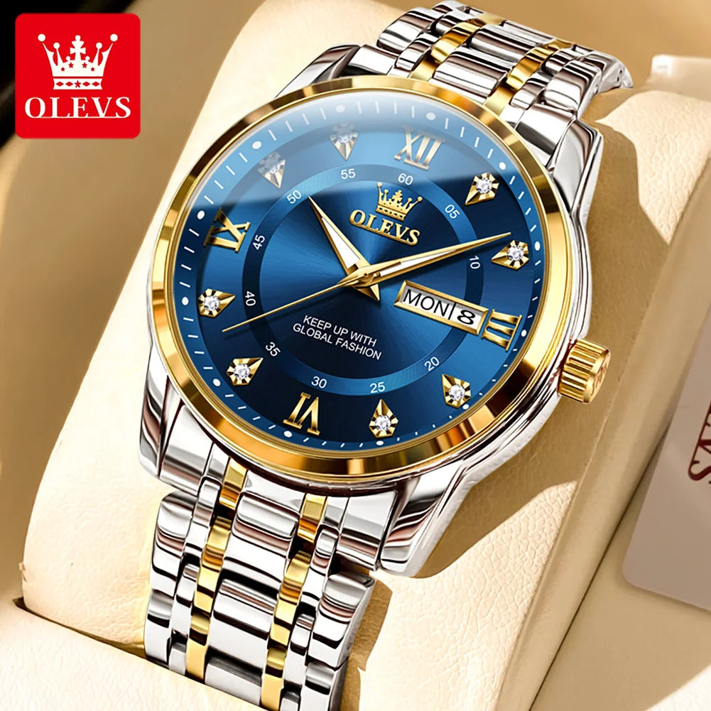A close-up of a silver stainless steel watch with a blue dial, gold accents, and a metal bracelet on a light background.