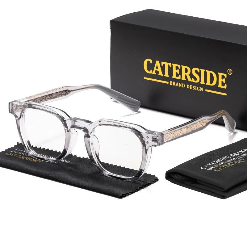 Clear retro square anti-blue light eyeglasses with gold accents displayed next to a black box and cloth.