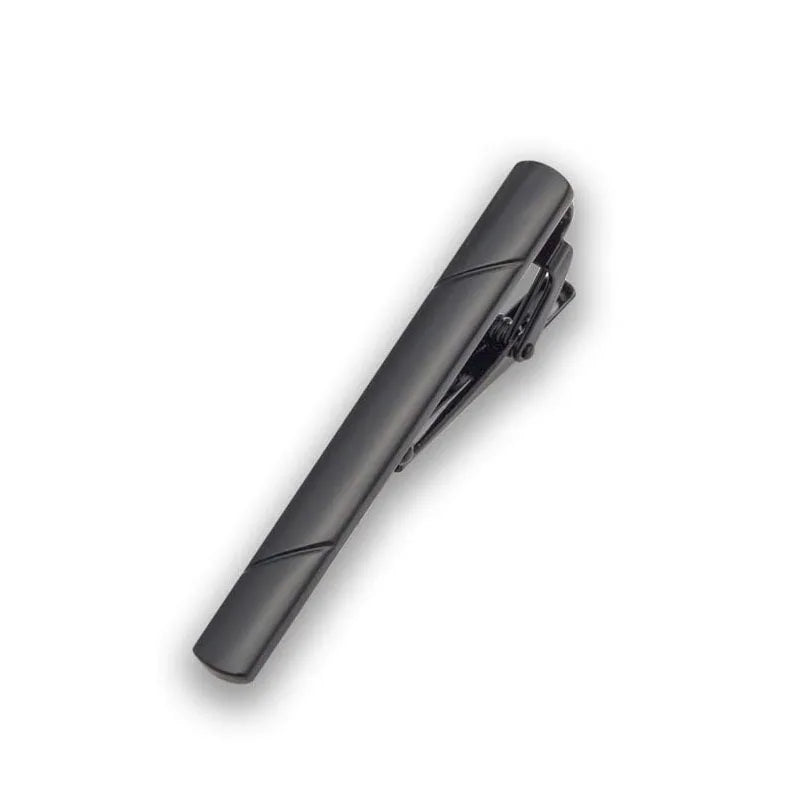 A close-up view of a black tie clip jewelry piece.