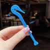 A hand holds a bright blue hair elastic and rubber band remover tool with a curved tip.