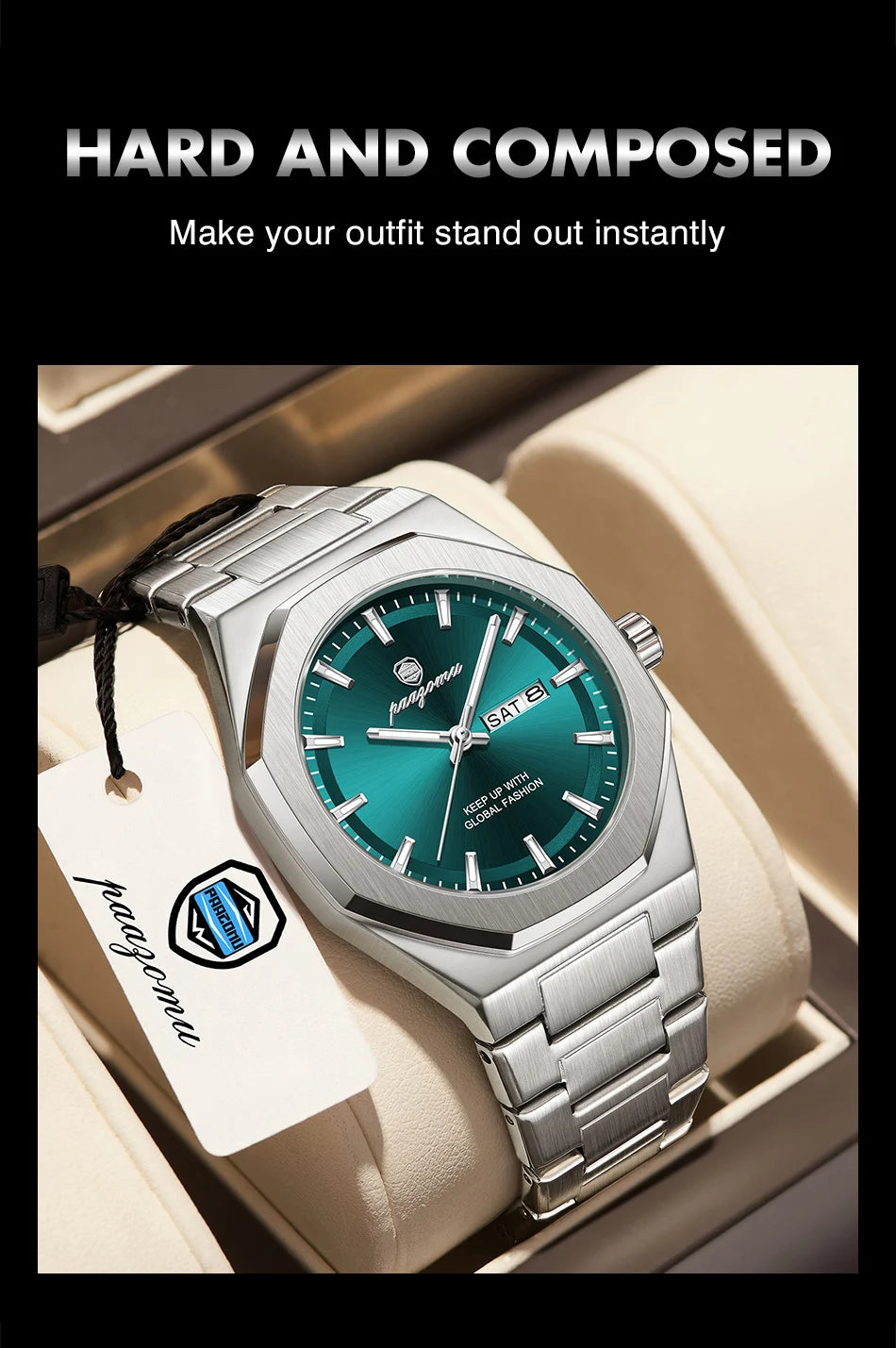 A silver stainless steel watch with a teal face and black strap is displayed in a light-colored box.