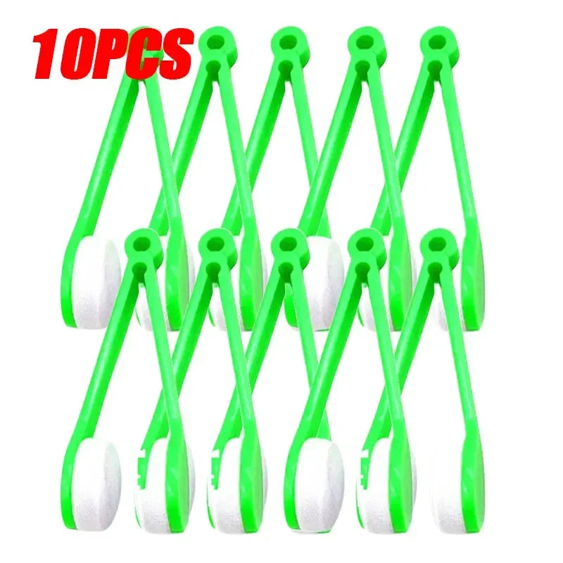 A set of ten green plastic tools used for cleaning eyeglasses or similar items.
