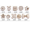 A collection of elegant button brooch pins featuring various shapes including leaves, crowns, stars, and floral designs.