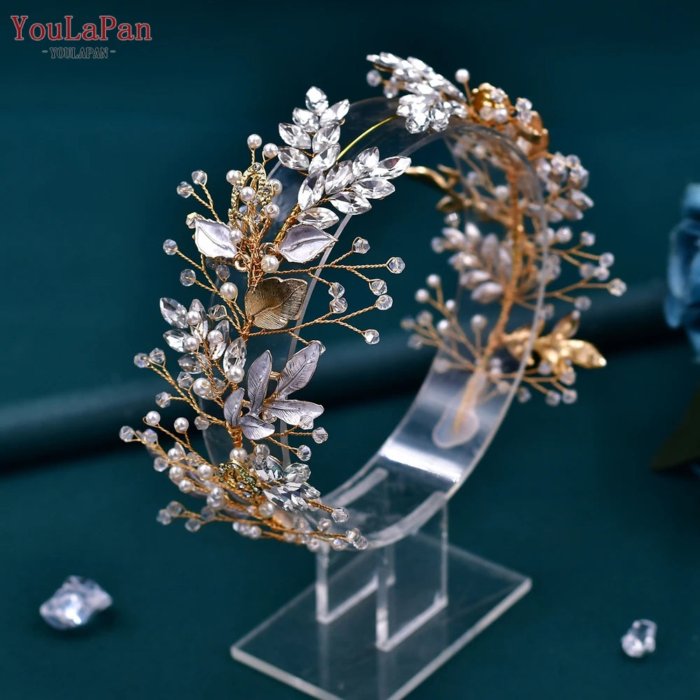 A handmade crystal bridal headband featuring gold-toned leaves and delicate clear crystals.
