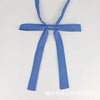 A light blue fabric ribbon tied in a bow with long tails, suitable for a classic butterfly tie set.