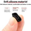 A hand is holding a black silicone ear tip for true wireless earbuds, demonstrating its soft and flexible material.