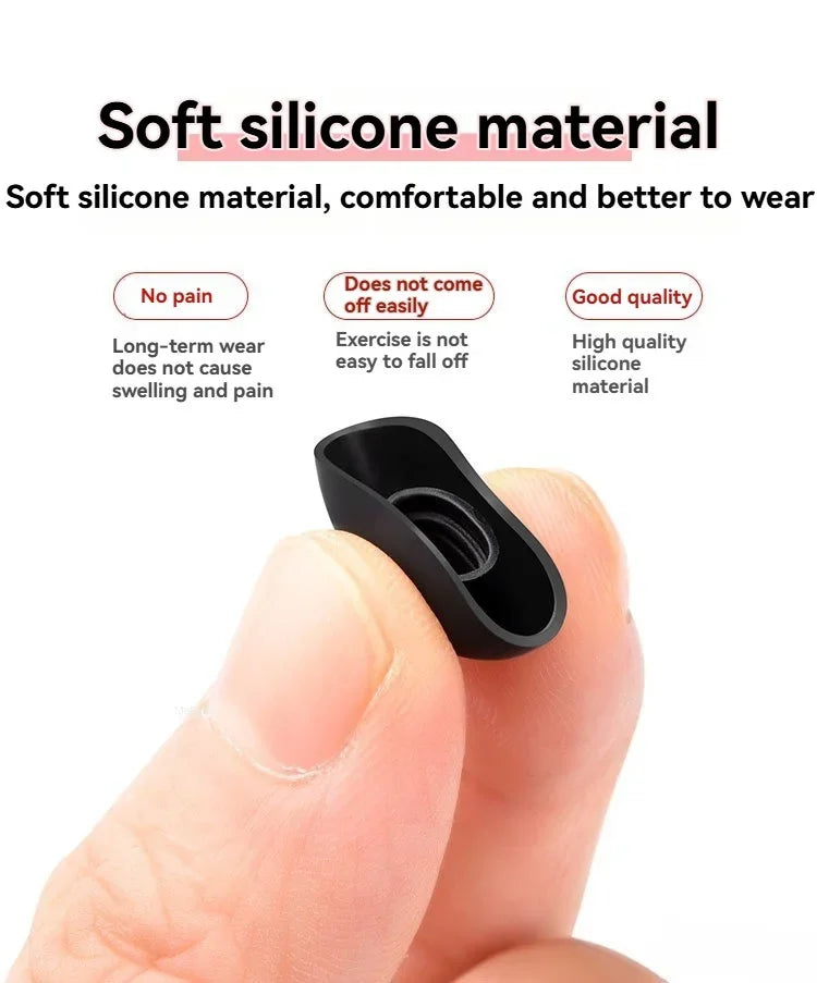 A hand is holding a black silicone ear tip for true wireless earbuds, demonstrating its soft and flexible material.