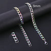 A pair of 9mm stainless steel Cuban link necklaces displayed on a black surface.
