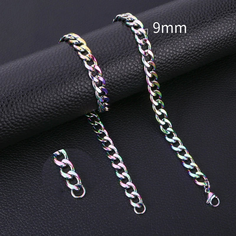 A pair of 9mm stainless steel Cuban link necklaces displayed on a black surface.