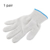A pair of white cotton thread work gloves with blue trim shown flat.