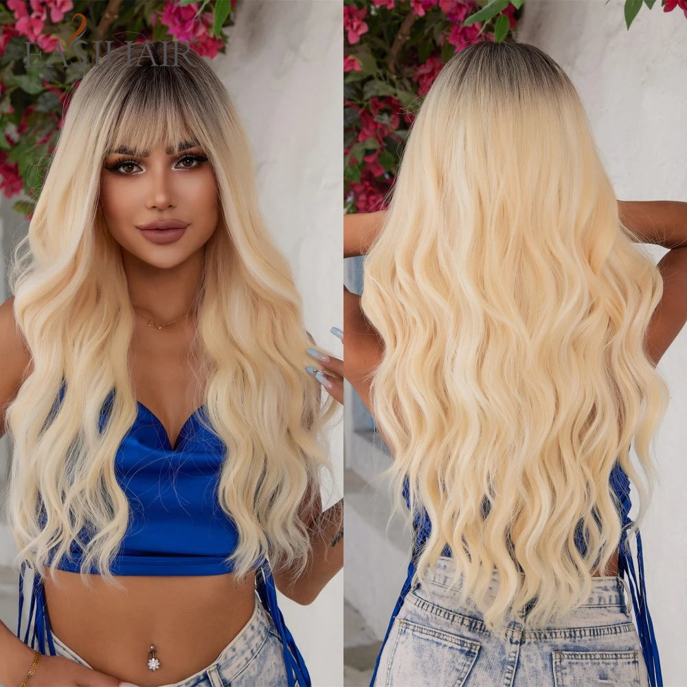 A model wearing a blue top and denim overalls with long blonde wavy hair