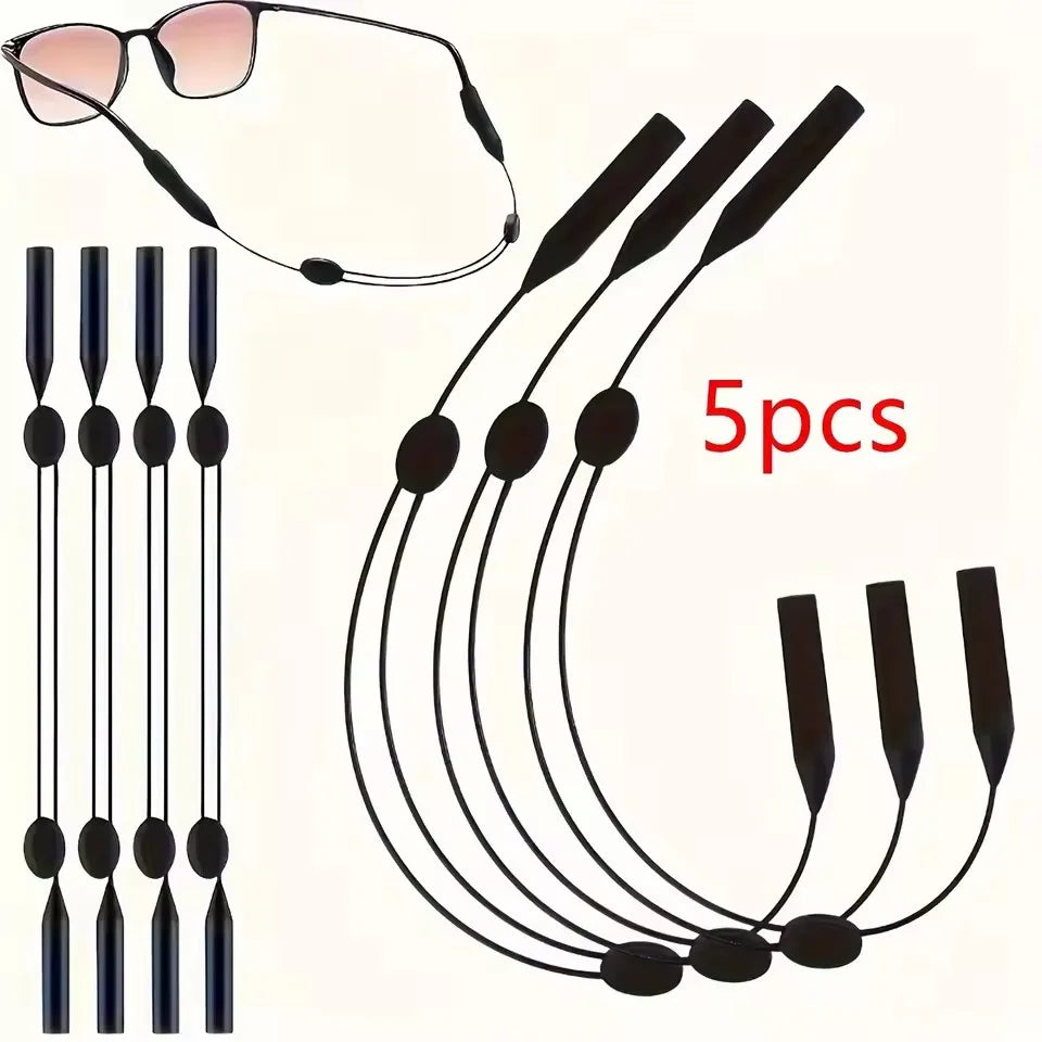 Un juego de cinco cordones y correas de gafas de silicona ajustables con un par de gafas de sol