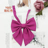 A solid magenta cotton bow tie tied in a decorative knot, shown against a white background.