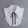 White blouse with a false collar and black tie detail