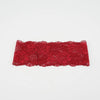 A piece of red floral lace used as a hair headband for women.