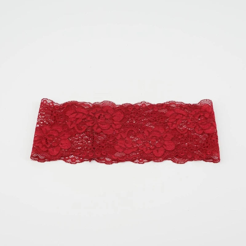A piece of red floral lace used as a hair headband for women.