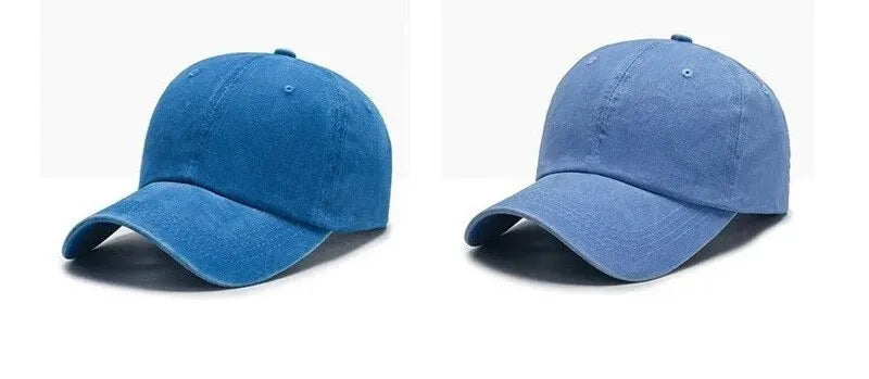 A pair of denim blue baseball caps shown in two views, one showing the front and another showing the side.