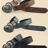 A close-up of a heart-shaped retro embossed leather belt in dark brown and black tones.