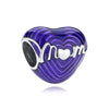 A heart-shaped charm made of purple iridescent glass with a silver embossed mother monogram.