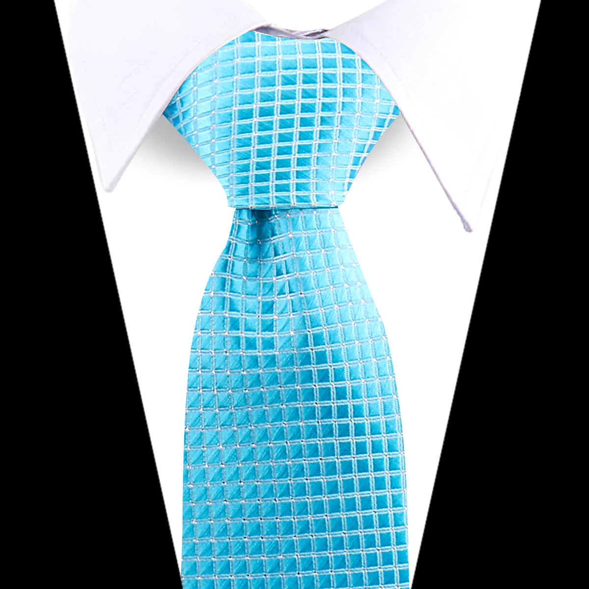 A bright turquoise patterned silk necktie displayed against a white shirt collar.