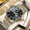A gold and silver watch with a dark blue dial and gold accents is displayed on a light background.