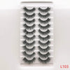 A strip of dramatic mink false eyelashes displayed in a clear plastic container.