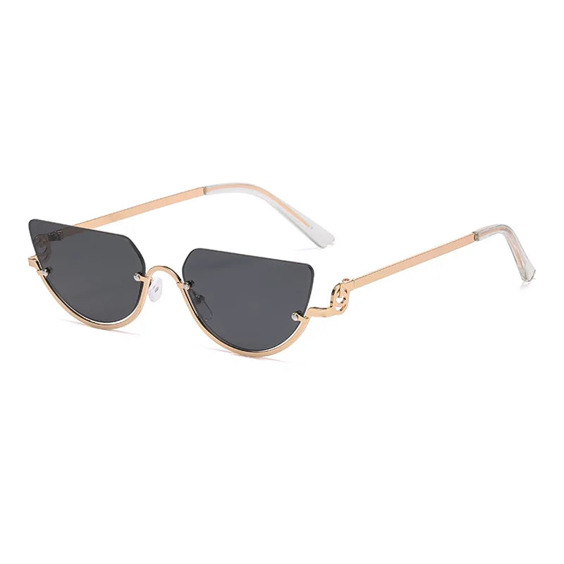 Lunettes de cat-eye vintage classiques avec monture métallique dorée et verres foncés