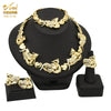 A gold heart crystal jewelry set featuring a necklace and earrings displayed on a black stand.