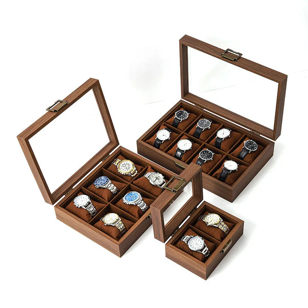 A wooden multi-slot display box for watches and jewelry, featuring several compartments.
