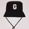 Black sun hat with a gold letter G print and an adjustable cord